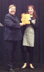 Brad Larkin presents the 2016 Genetic Genealogist of the Year Award plaque to Katherine Borges